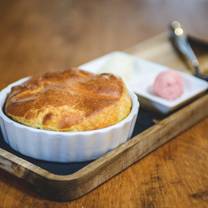Boone Tavern Hotel & Restaurant signature dishes Spoonbread (a cornmeal soufflé), Boone Tavern Fried Chicken, The "Berea Hot Brown," various seasonal entrees.